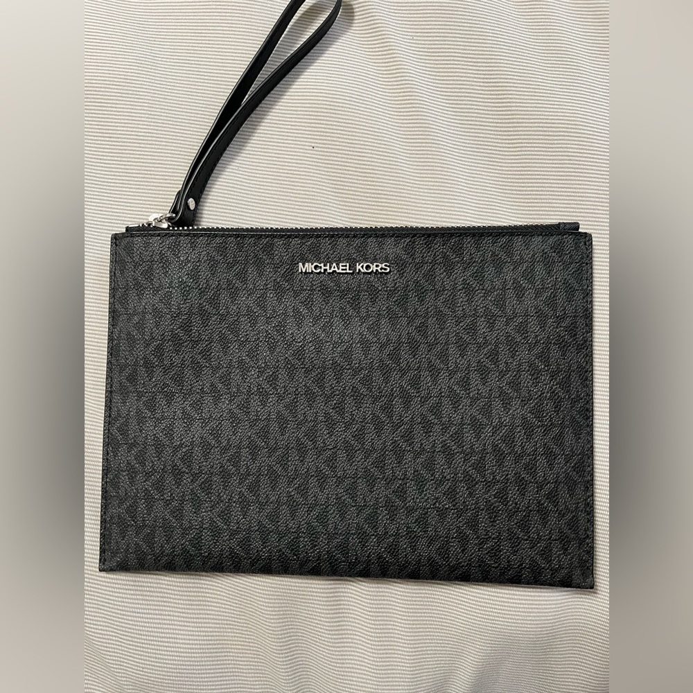 Michael Kors large zipper clutch/wristlet. Used one time. Excellent condition